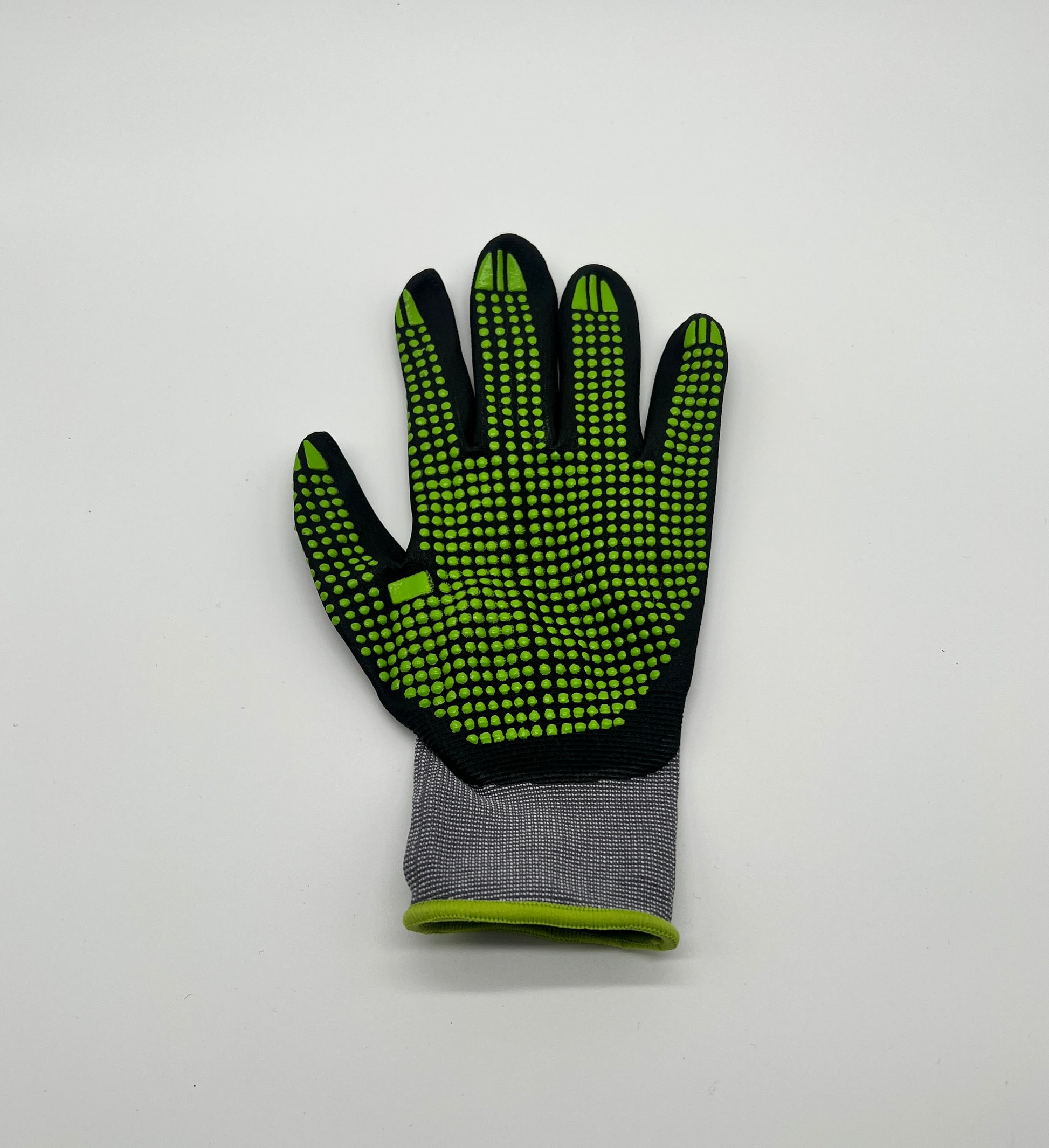 Super flexibler Handschuh in schwarz/grauer Farbe mit grünen Noppen